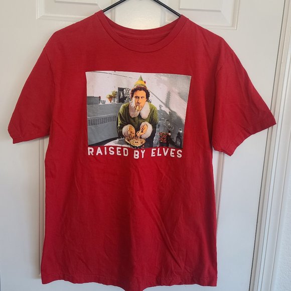 Elf The Movie Tee Shirt - Raised By Elves Red Short Sleeve - Picture 1 of 3
